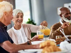 Diverse group of seniors enjoying breakfast together