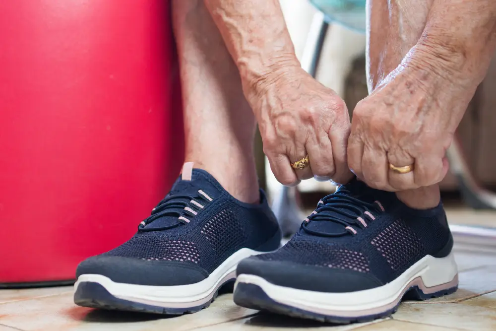 close up of a senior tying their shoes