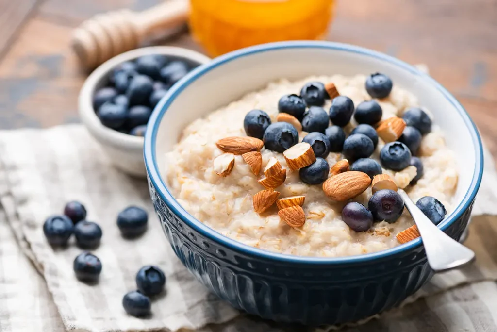 a bowl of oatmeal with blueberries in it
